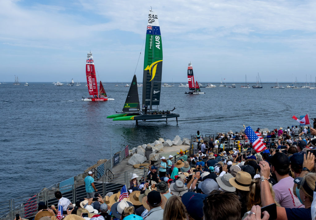 Spectators watch from the grandstand in the Race Stadium as Australia SailGP Team sail past on Race Day 1 of the Oracle Los Angeles Sail Grand Prix at the Port of Los Angeles, in California, USA. 22nd July 2023. Photo: Adam Warner for SailGP. Handout image supplied by SailGP